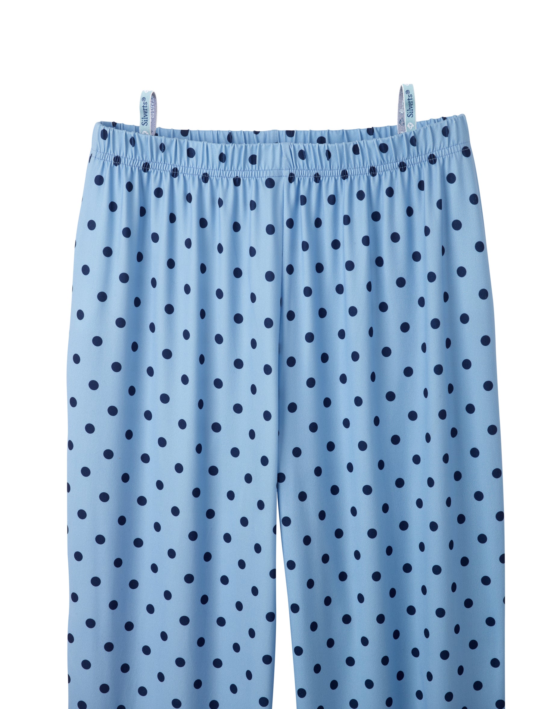 Light blue pants with a dark blue polka dot pattern, featuring an elastic waistband, shown hanging from two clips against a white background.
