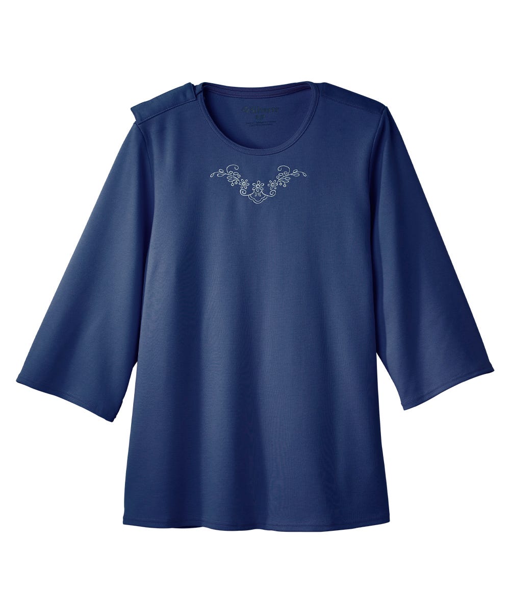 Blue shirt with floral embroidery on a white background